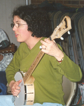 Carol singing and playing banjo.