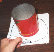 Cut paper 1 inch larger than diameter of can.